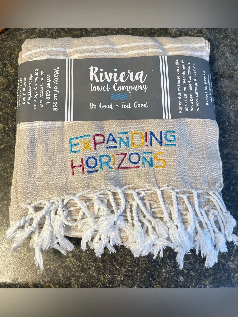 Riviera Towel Company Turkish Pestemal towel in a beige color white stripes.